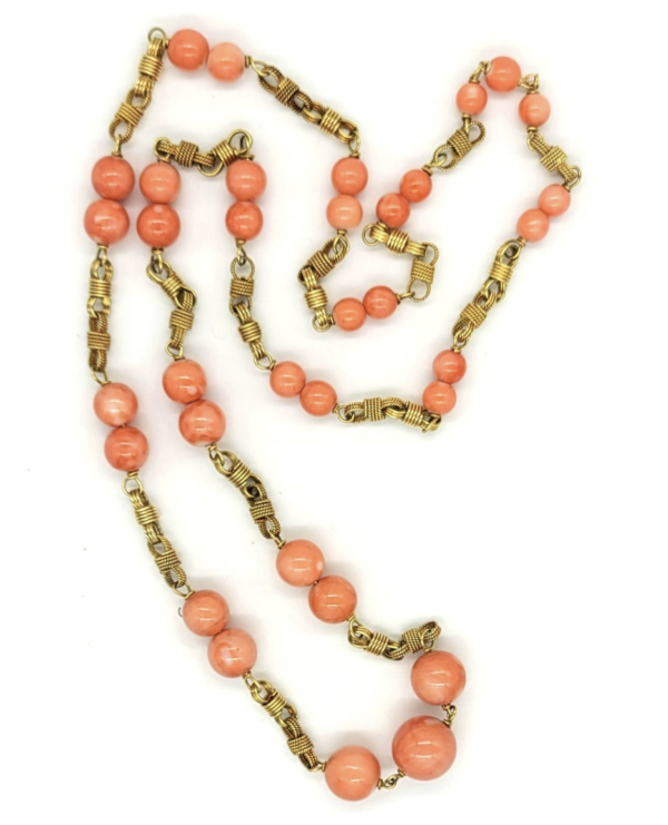 Beaded coral long necklace with braided and smooth links