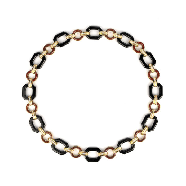 Long necklace of geometrical design, with octagonal shaped onyx, circular jasper, connected by 18k yellow gold and diamond links
