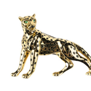 Collectible Cartier Panthere brooch in 18k gold with black enamel spots and emerald eyes