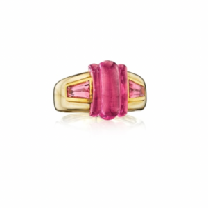 Bulgari tourmaline ring in 18k gold, set with a fluted cabochon tourmaline, and pink tourmaline shoulders.  Made in Italy, circa 1985.