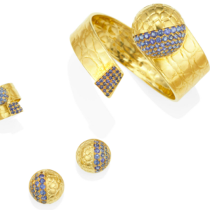 Gucci parure consisting of a bracelet and ring of a flexible by-pass design and earrings with an animal print pattern and sapphire accents. made in Italy, circa 1970.