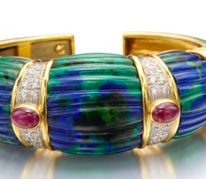 David Webb 18k gold hinged cuff composed of fluted azurmalachite segments, with cabochon ruby and round diamonds. Made in America, circa 1975.