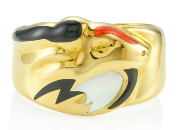 Elsa Peretti for Tiffany: A hinged cuff of the Zodiac symbol for Capricorn of a goats head and fish tail in 18k yellow gold, coral, black jade, and mother of pearl